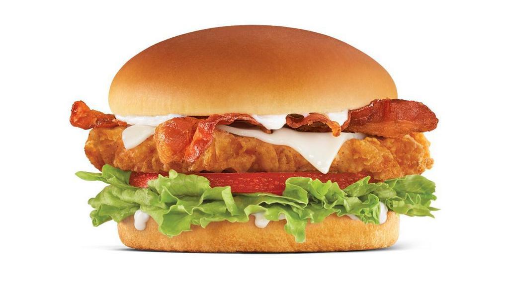 Hand-Breaded Bacon Swiss Chicken Sandwich · Premium, all-white chicken fillet, hand dipped in buttermilk, lightly breaded and fried to a golden brown, topped with bacon, Swiss cheese, lettuce, tomato, and mayonnaise on a potato bun.