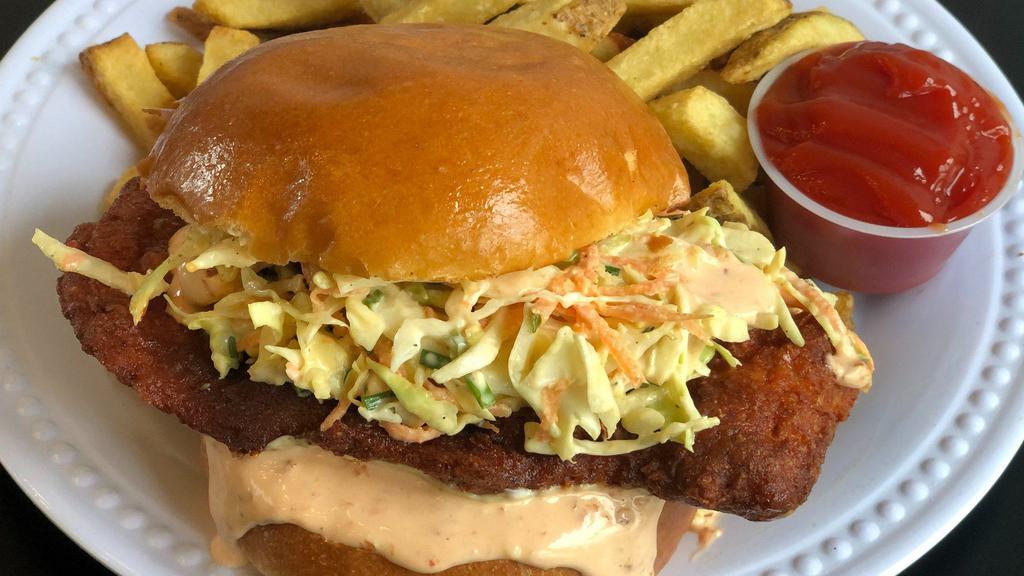 The Nashville Fried Chicken Sandwich · Buttermilk fried chicken coated in our Nashville hot seasoning. Topped with our sweet and spicy slaw, sriracha mayonnaise, and served on a toasted bun.