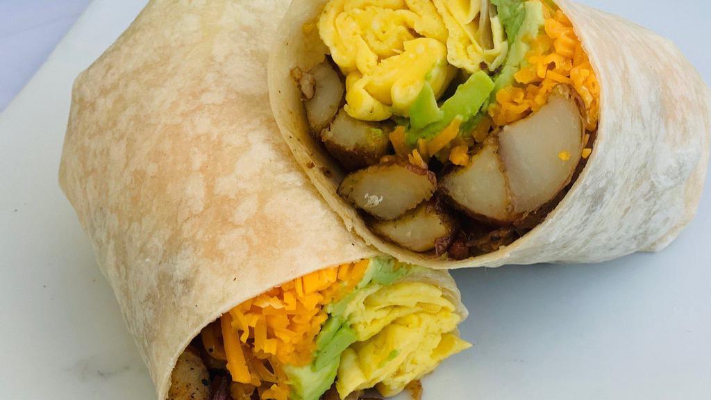 The Vegetarian Breakfast Burrito · A massive unit of two scrambled eggs, the impossible vegetarian sausage, melty Cheddar, home fries, avocado, onion marmalade.