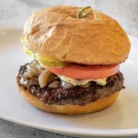 The Burger · A juicy 6 oz burger served on a perfect brioche bun with caramelized onions, chipotle remoul...