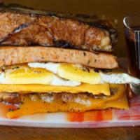 Sausage, Egg, ＆ Cheddar French Toast Sandwich · The breakfast trinity available all day.