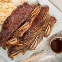 BBQ Short Ribs · Juicy beef short ribs marinated in our house
BBQ sauce and grilled to perfection,2 rice & 1 ...