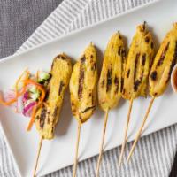 #4. Siam Satay · Charcoal broiled chicken or beef skewers marinated in Thai spices and served with peanut sau...