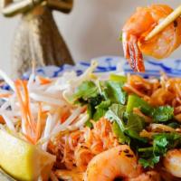 #56. Legendary Pad Thai · Chicken, beef, pork, or prawns stir fried with thin rice noodles, egg and tofu served with g...