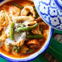 Panang Curry · With bell peppers, jalapenoes, carrot, baby corn, coconut milk and kirfir lime leaf (contain...