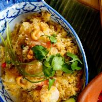 #65. Pineapple Fried Rice · Chicken, beef, pork or prawn fried with rice, pineapple, cashew nuts, onions and egg.
