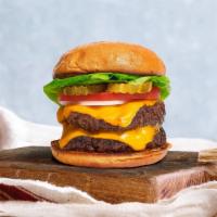 Stacked Cheese Burger  · Two seasoned vegan burger patties topped with melted vegan cheese, lettuce, tomato, onion, a...