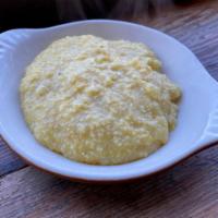 Side Polenta · Side of house-ground polenta, cooked with butter.