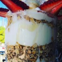 Breakfast Yogurt Parfait · Layered with strawberrries, bananas and granolas.