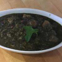 Ghormeh Sabzi · Green onion, parsley, spinach, and herbs sauteed and cooked with beef, served with basmati r...