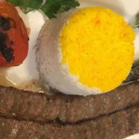 Beef Koobideh Kabob  · Two skewers of barbecued ground sirloin served with basmati rice, BBQ tomato and pepper.