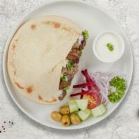 Miss Arayes · Grilled pita bread stuffed with ground lamb and beef, onion, tomatoes and spices.
