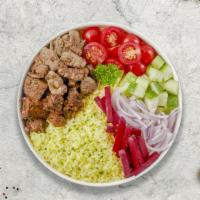Lamb & Beef Shawerma Plate · Lamb and beef shawerma, served with rice, house salad, hummus, pickles, tahini sauce and pit...