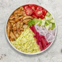 Cluckin' Shawerma Plate · Chicken shawerma, served with rice, house salad, hummus, pickles, tahini sauce and pita bread.