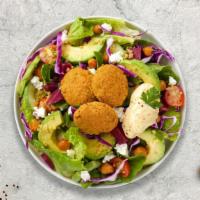 Bouncing Falafel Balls Over House Salad · Falafel balls, lettuce, parsley, cucumber, tomatoes, feta cheese with special house dressing.