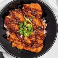 Chicken Katsu Don · Panko breaded fried chicken cutlet over rice and glazed with unagi sauce topped with green o...