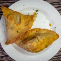 Samosa Chaat · (N. Delhi Special) Lip smacking chaat made with chickpeas, various chutneys, spices and yogu...