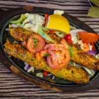 Chicken Seekh Kabab · Minced chicken, onion, chili, herbs, spices skewered baked in tandoor.