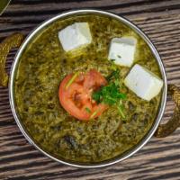 Palak Paneer · Spinach with home made cheese sauce, herbs & spices.