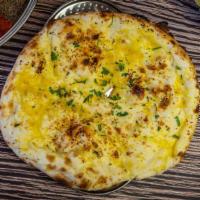 Garlic Naan · Soft bread with garlic freshly baked in tandoor.