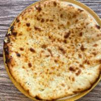 Cheese Naan · Soft bread stuffed with cheese freshly baked in tandoor.