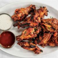 Grilled Buffalo Wings · Party wings grilled with savory spices.