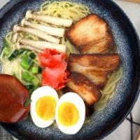 Tonkotsu Ramen · Toppings: egg, corn, wakame, mushroom, green onion.