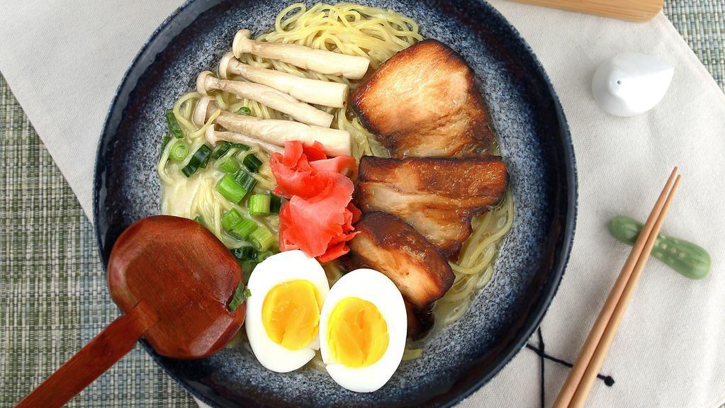 Tonkotsu Ramen · Toppings: egg, corn, wakame, mushroom, green onion.