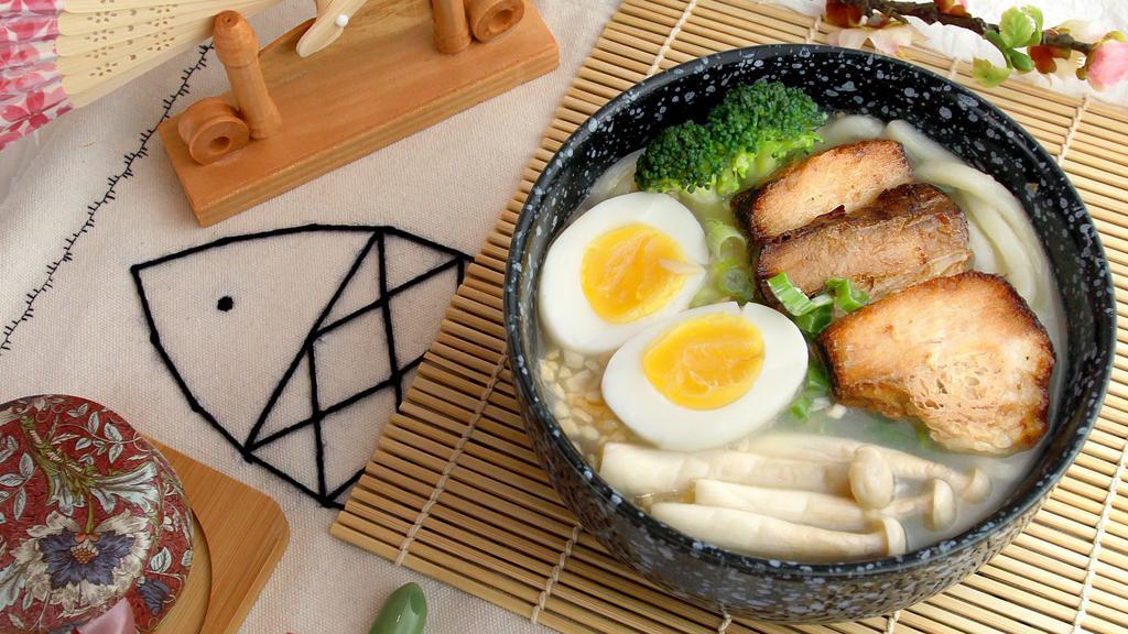Tonkotsu Udon · Toppings: egg, corn, wakame, mushroom, green onion.