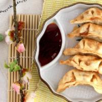Gyoza (5 Pieces) · Pork and vegetable potstickers.