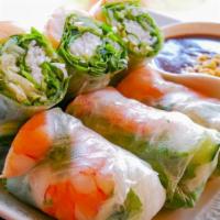Veggie Summer Rolls · Soft rice paper rolls filled with fresh seasoned vegetables.
