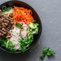 Charbroiled Beef Garlic Vermicelli · Garlic infused beef and fresh lemongrass on vermicelli, mixed lettuce, sprouts, mint, and cu...