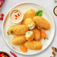 Jalapeno Poppers · (Vegetarian) Fresh jalapenos coated in cream cheese and fried until golden brown.