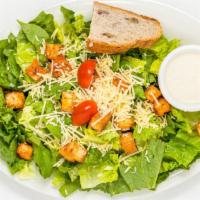 Caesar Salad · Crisp romaine lettuce, with our house Caesar dressing served with home made garlic croutons,...