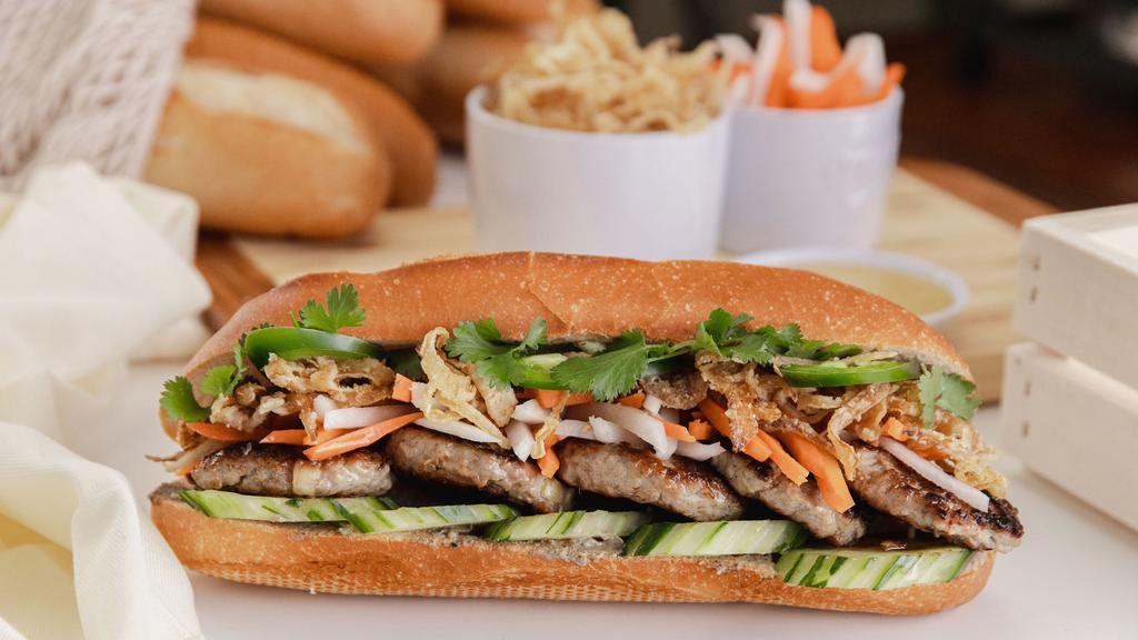 Medallion Bánh Mì · Baguette Bánh mì thịt nướng: Chicken & pork lemongrass patties, crispy fried onions, sweet pickled carrots & daikons, cucumbers, cilantro, Mommy's Signature Sauce, chicken pate, jalapeños in a fresh baguette