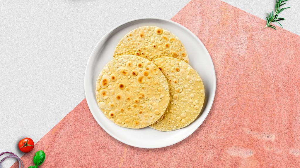 Papadam · Thin Indian cracker or flatbread served as a side.