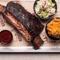 BBQ Smoked Pork Ribs · House smoked pork ribs served with your choice of 2 signature sides.