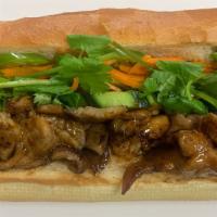 Grilled Pork Banh Mi · Grilled pork, pickled carrot, cilantro, scallion, jalapeños, chilli paste, mayonnaise, and s...