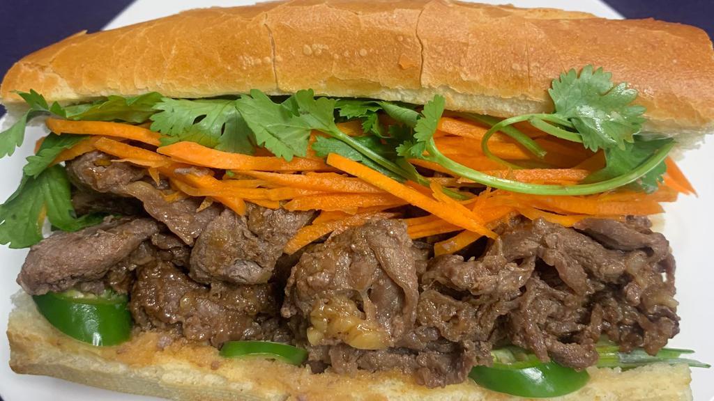 BBQ Beef Banh Mi · BBQ beef, pickled carrot, cilantro, scallion, jalapeños, chilli paste, mayonnaise, and soy sauce.