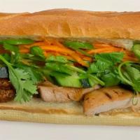 Grilled Chicken Banh Mi · Grilled chicken, pickled carrot, cilantro, scallion, jalapeños, chilli paste, mayonnaise, an...