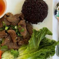 37. BBQ Pork · BBQ pork over black rice with vegetables.