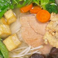 41. Vegetable Pho · Pho noodles with tops of broccoli, carrot, shiitake mushroom, tofu, veggie ham, and veggie g...