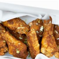Chili Lime Dry Rub Wings · Our signature dry rub flavor explosion, topped with freshly-grated lime zest.