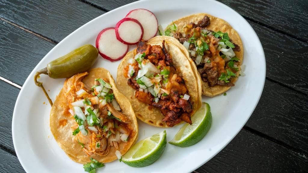 Plato Especial De Tacos · Three tacos, choice of meat, rice, and beans.