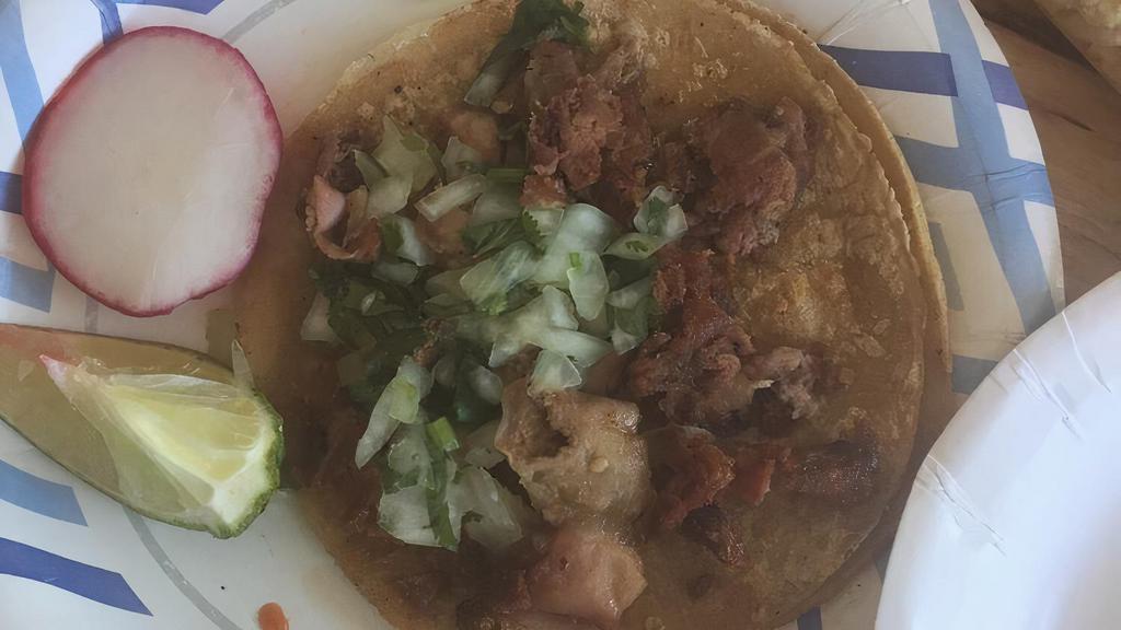 Taco De Tripa · Beef intestine, onions, cilantro, and salsa.