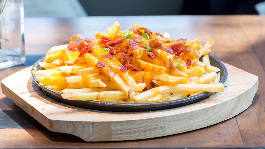 Cheese Fries · Fresh batch of french fries topped with melted cheese.