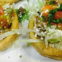 Sope + Rice & Beans · A single sope with rice and beans!