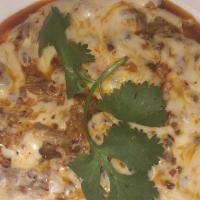 Queso Fundido · Melted cheese with savory chorizo. Comes with corn or flour tortillas.