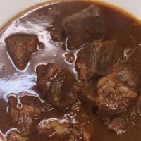 Birria en Su Jugo · Slow-cooked beef stew or soup.