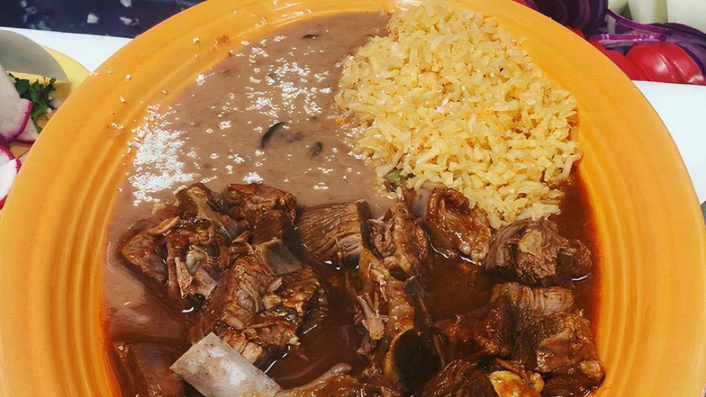 Birria con Arroz y Frijoles · Slow-cooked beef stew or soup with rice and beans.